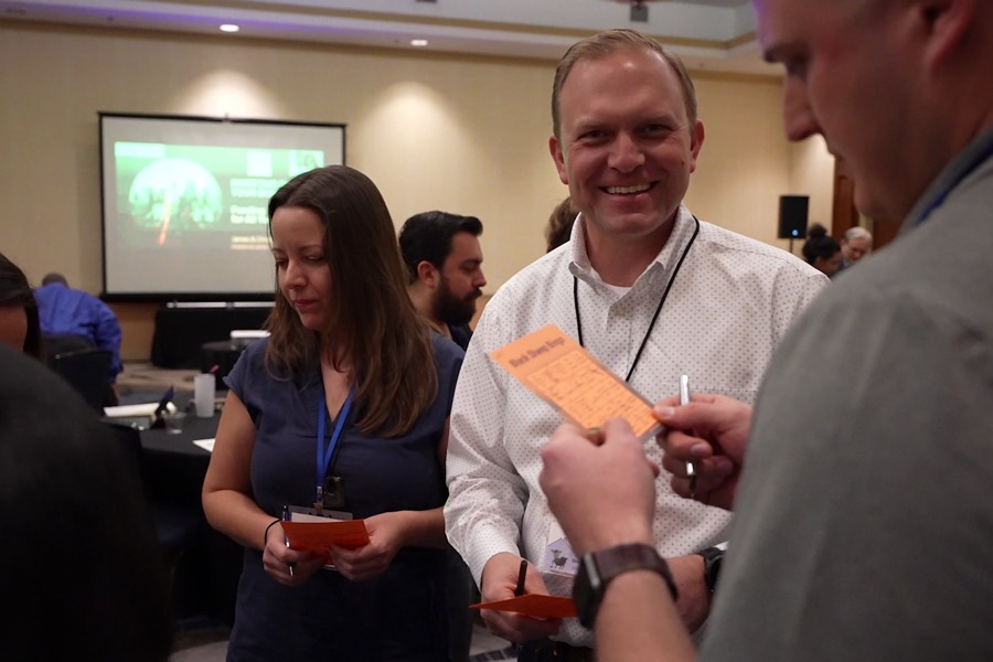 Attendees trading contacts between sessions