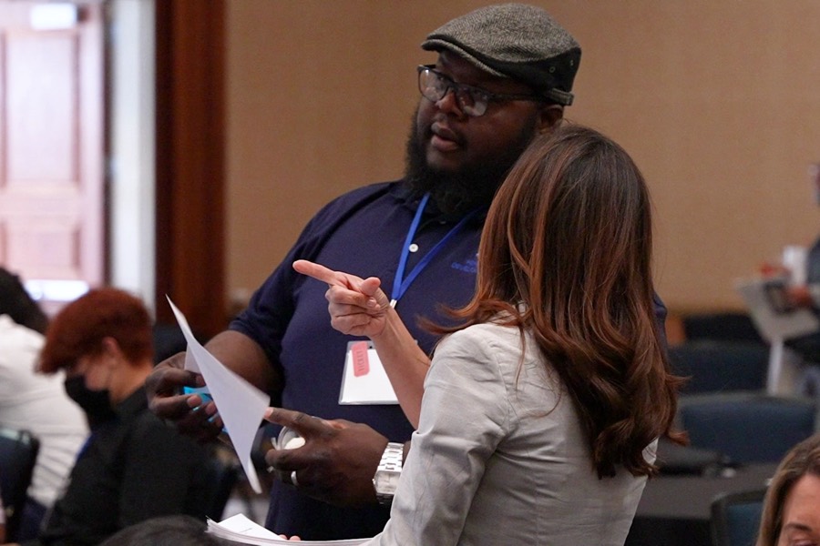 Attendees talking deals